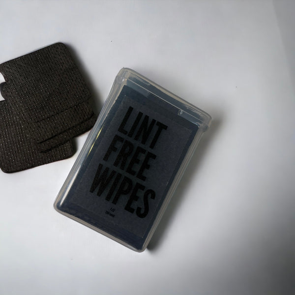 Adhesive nozzle wipes